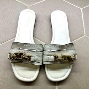 Zara white slippers with gold detail.